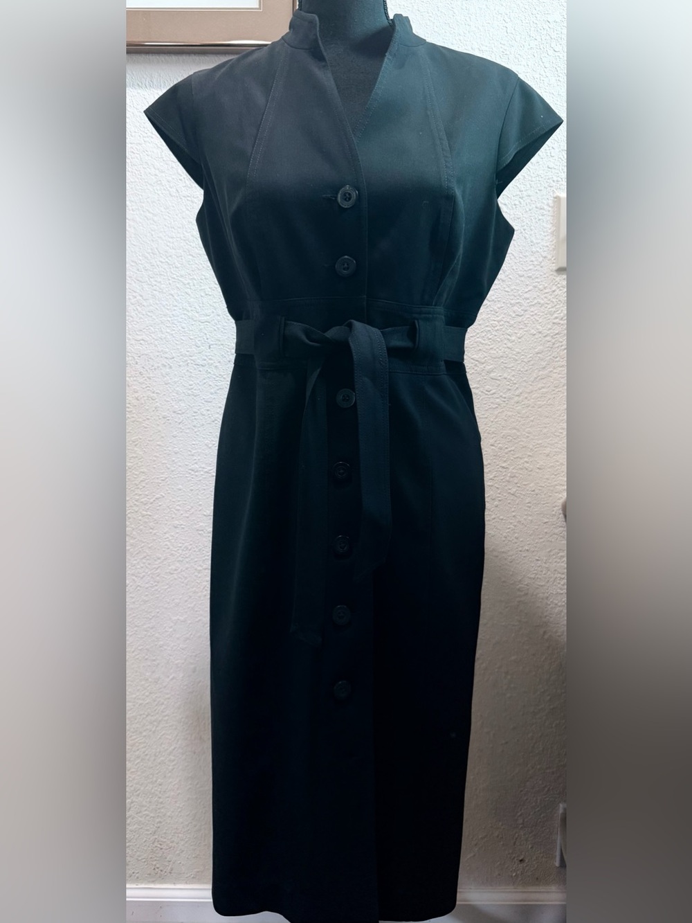 Women's striking black trench coat dress
